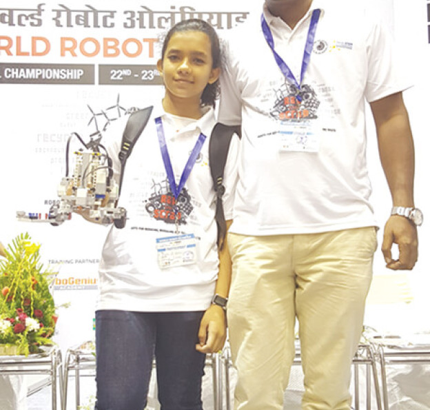 Vivekan Monami S. Saha with her coach & mentor Mr. M.F. Haque at National Championship, World Robot Olympiad, 2016, Netaji Indoor Stadium, Kolkata